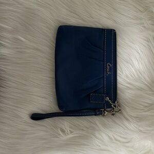 Cobalt blue, leather Coach wristlet.